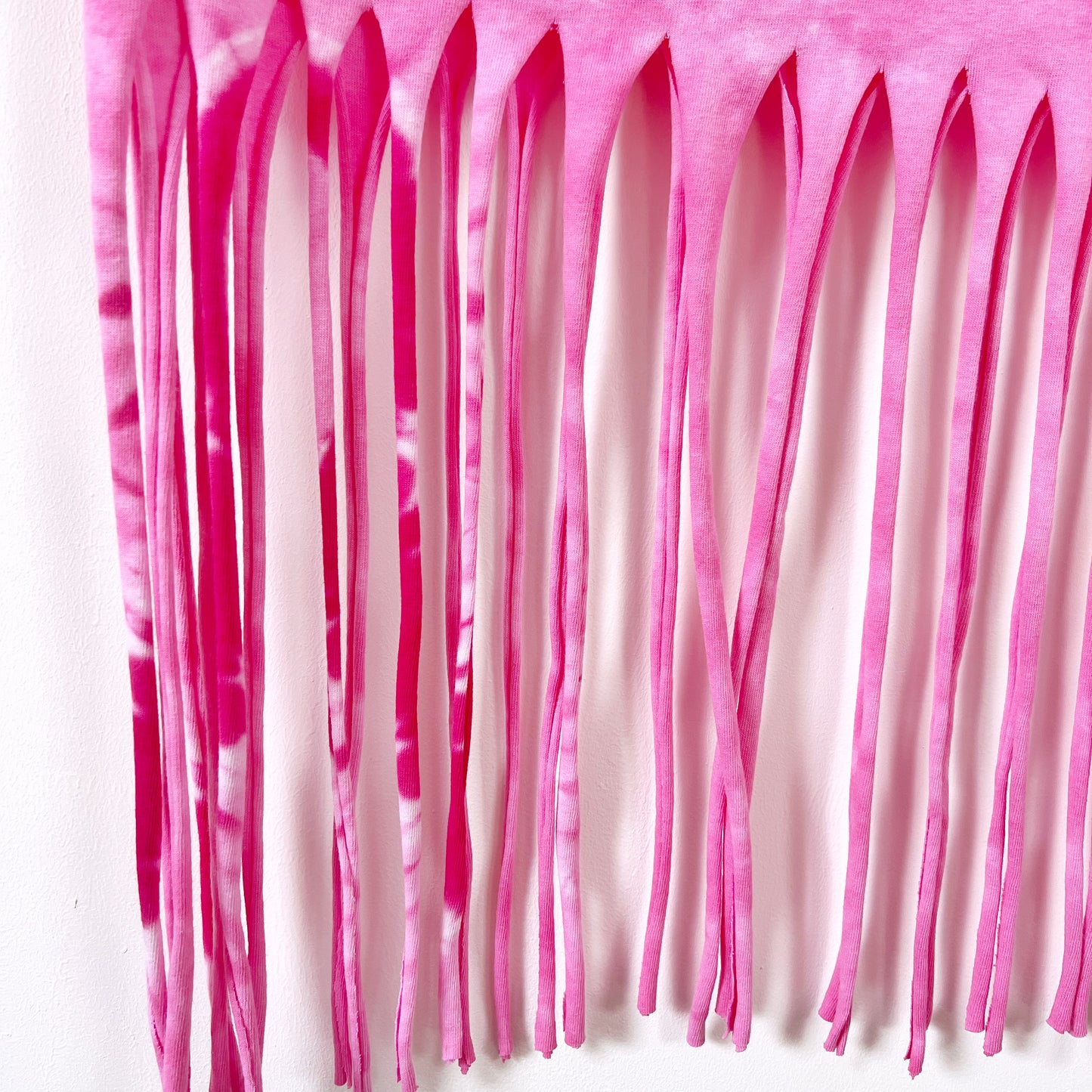 radiate love tie-dye tassel top