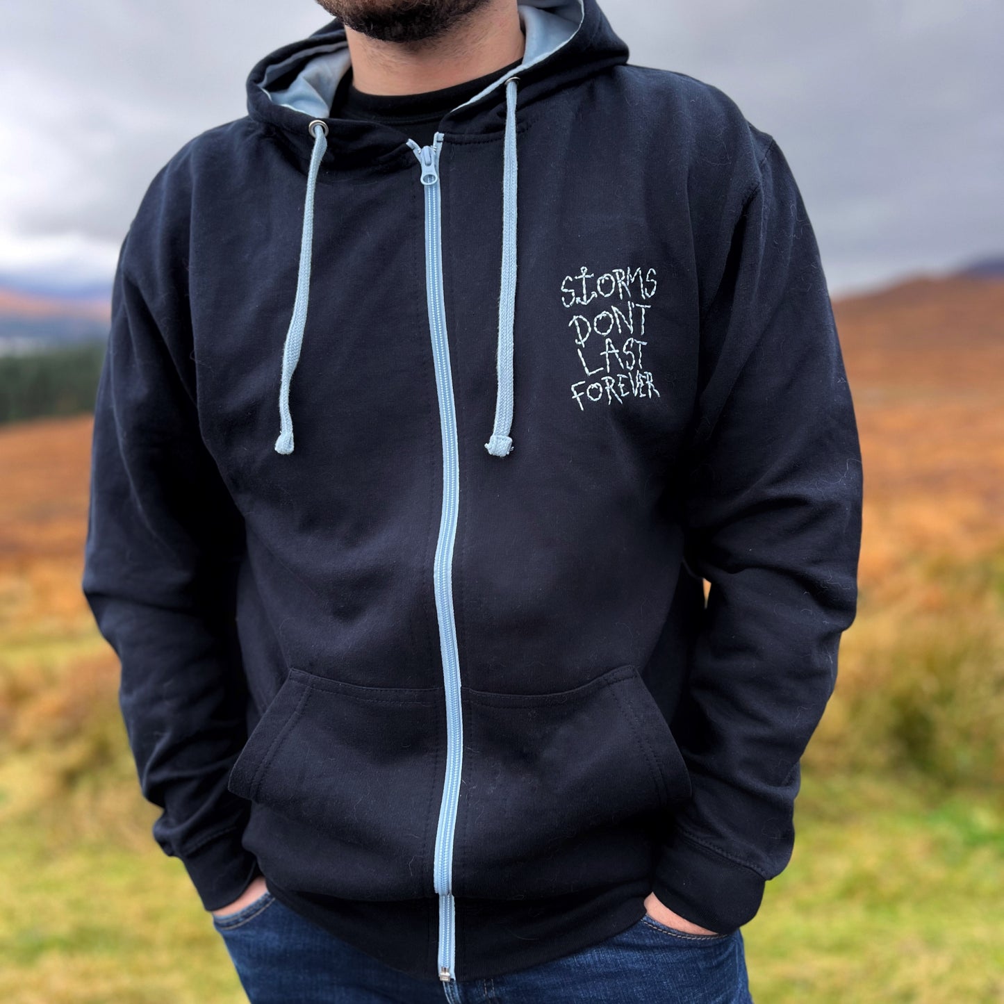 storms don’t last forever embroidered zip-up hoodie