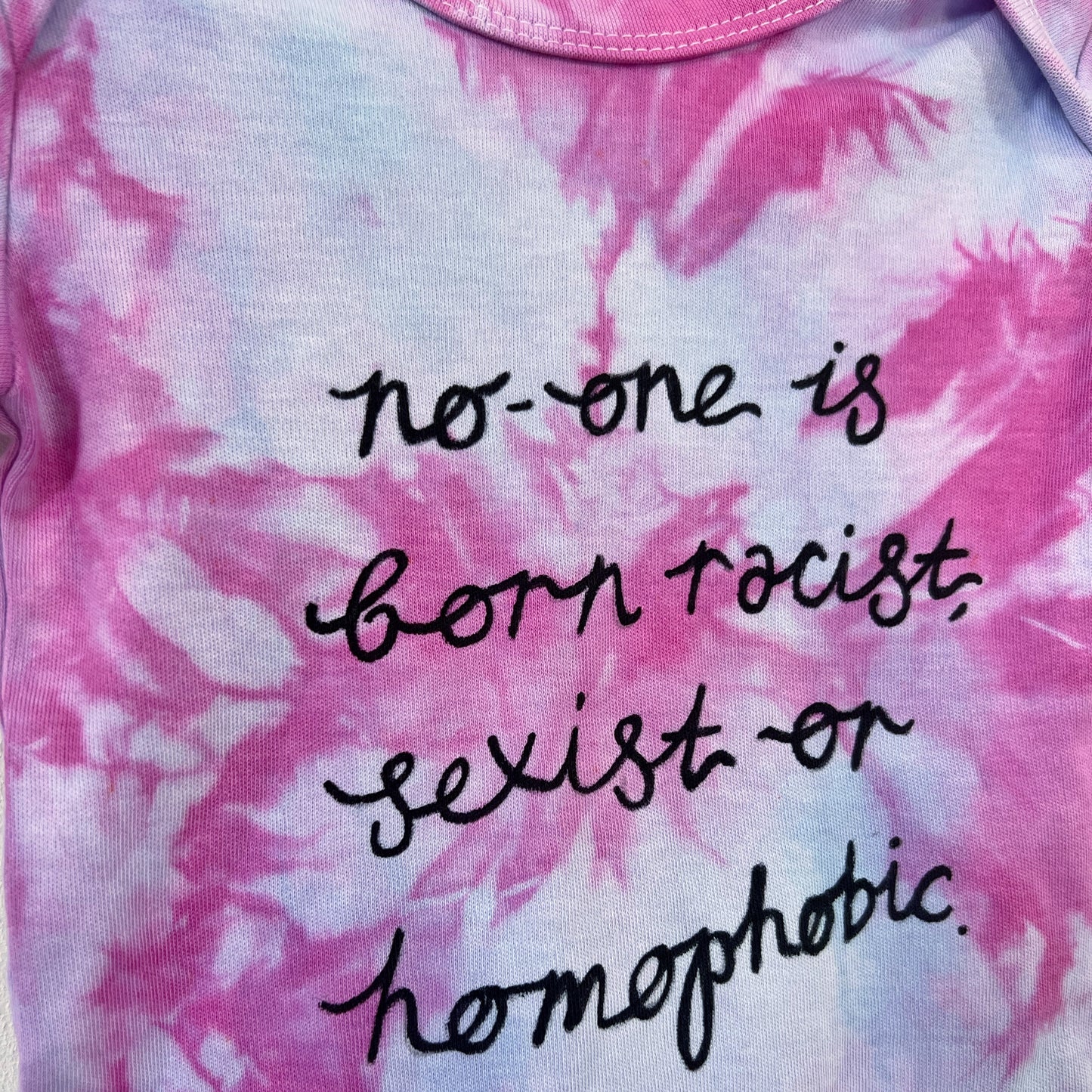 hate is taught tie dye baby bodysuit