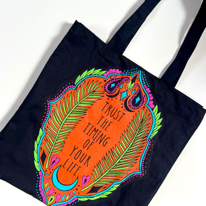 trust the timing of your life tote bag