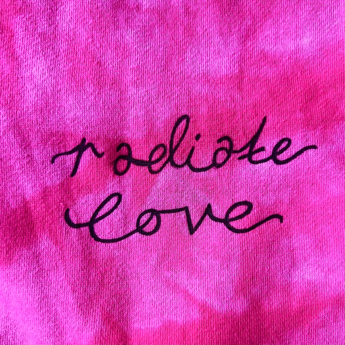 radiate love script tie dye onesie - pink