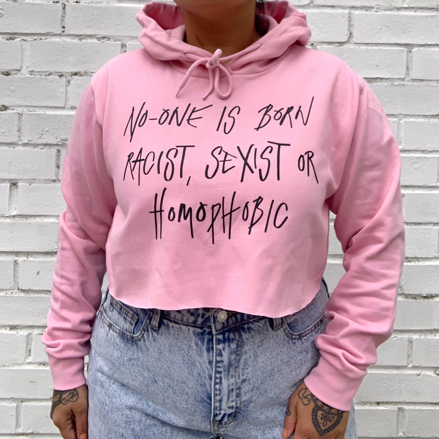 hate is taught cropped hoodie - baby pink