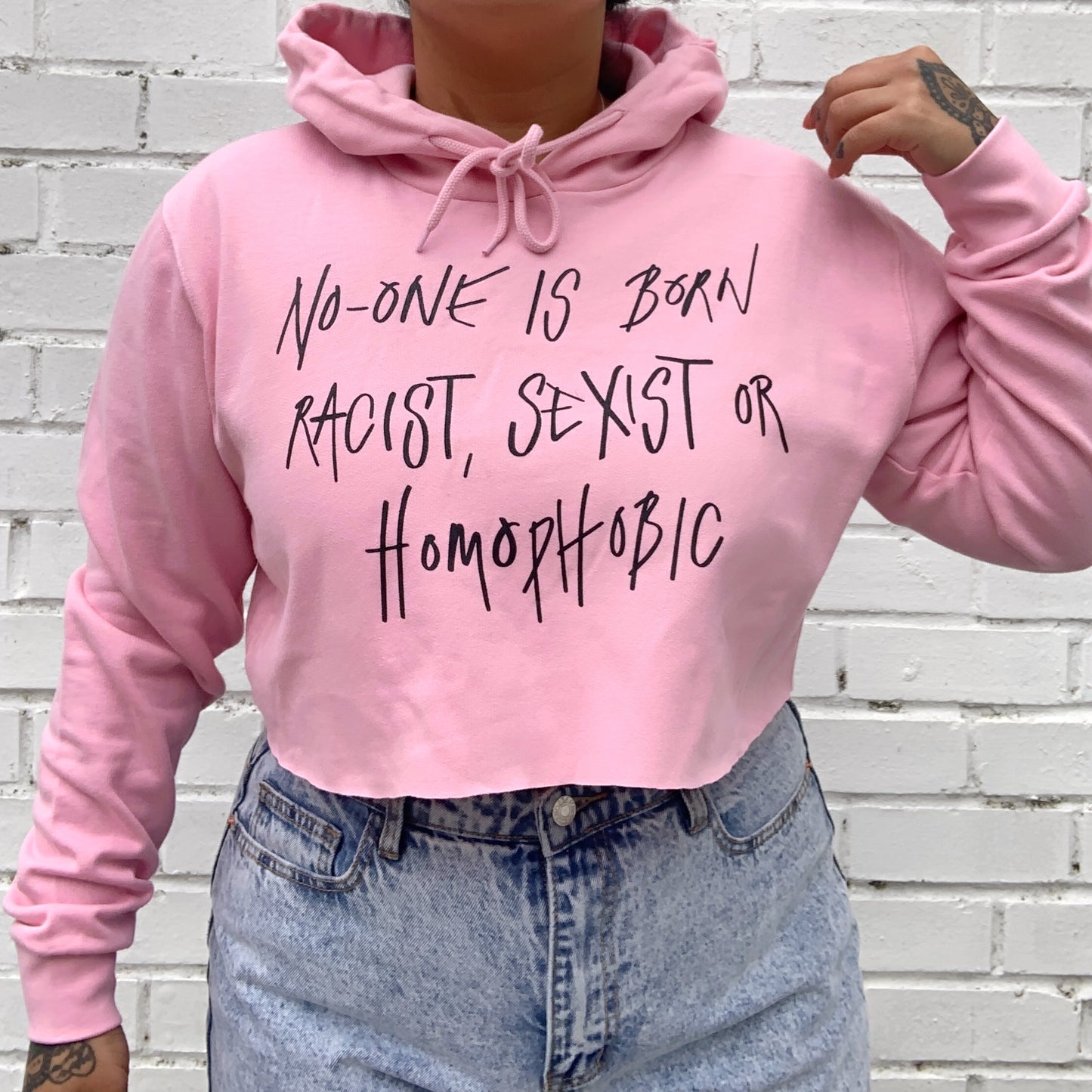 hate is taught cropped hoodie - baby pink