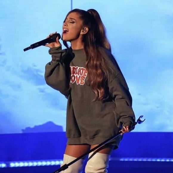 Ariana Grande wearing the Radiate Love sweatshirt on The Ellen Show.
