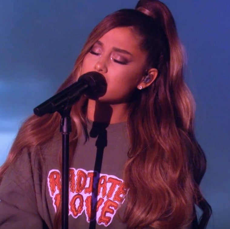 Ariana Grande wearing the Radiate Love sweatshirt on The Ellen Show.
