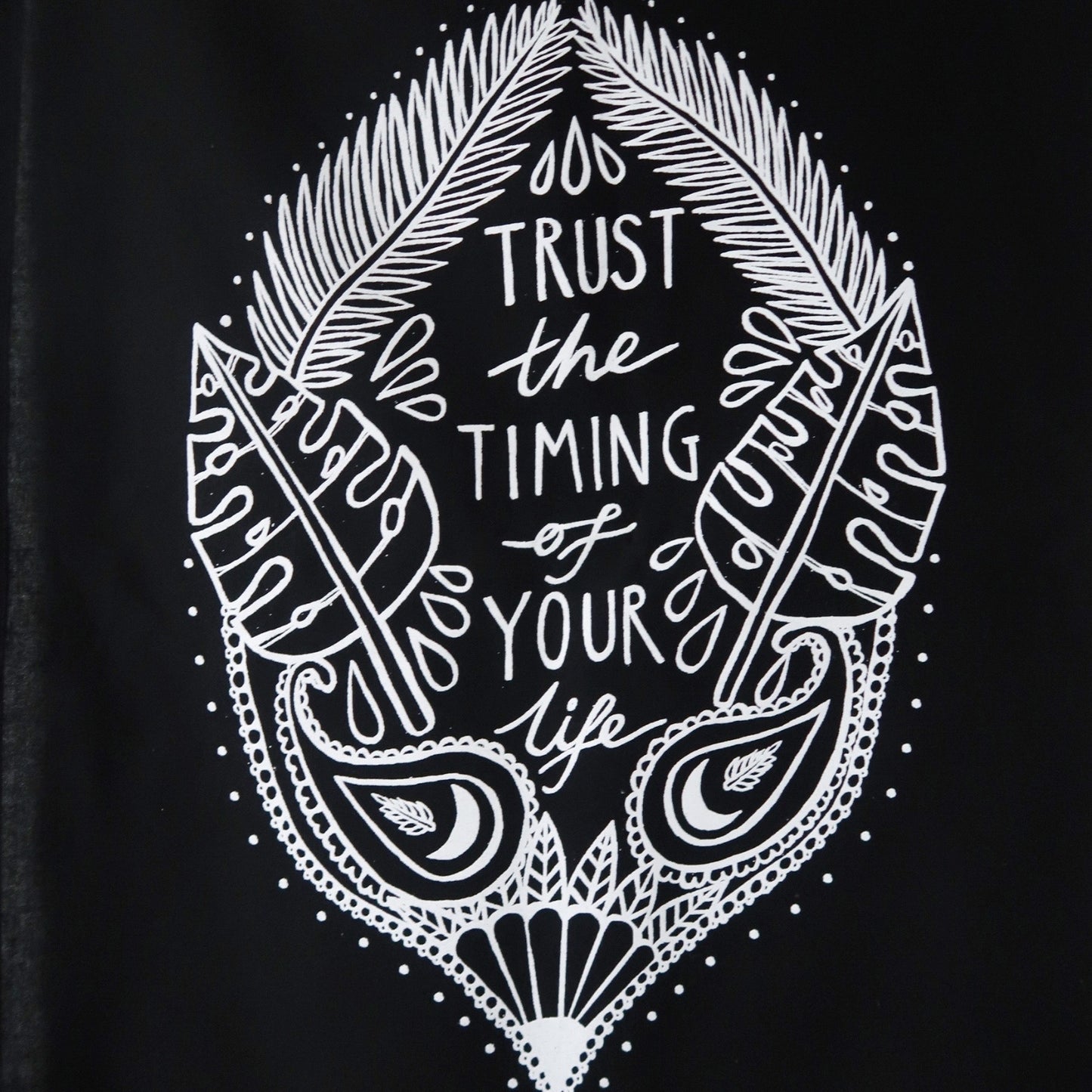 trust the timing of your life wall hanging - black