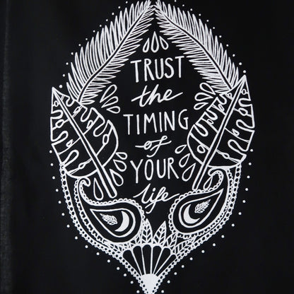 trust the timing of your life wall hanging - black