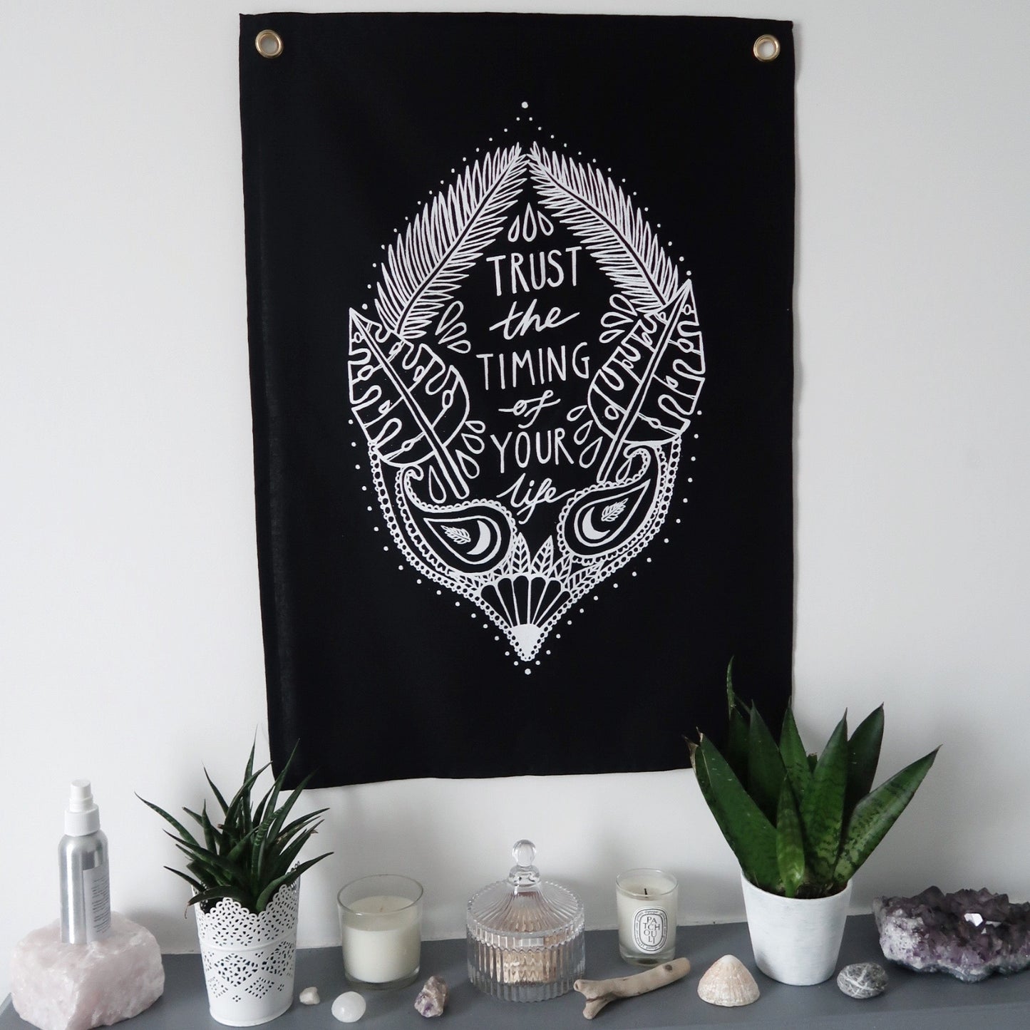 trust the timing of your life wall hanging - black