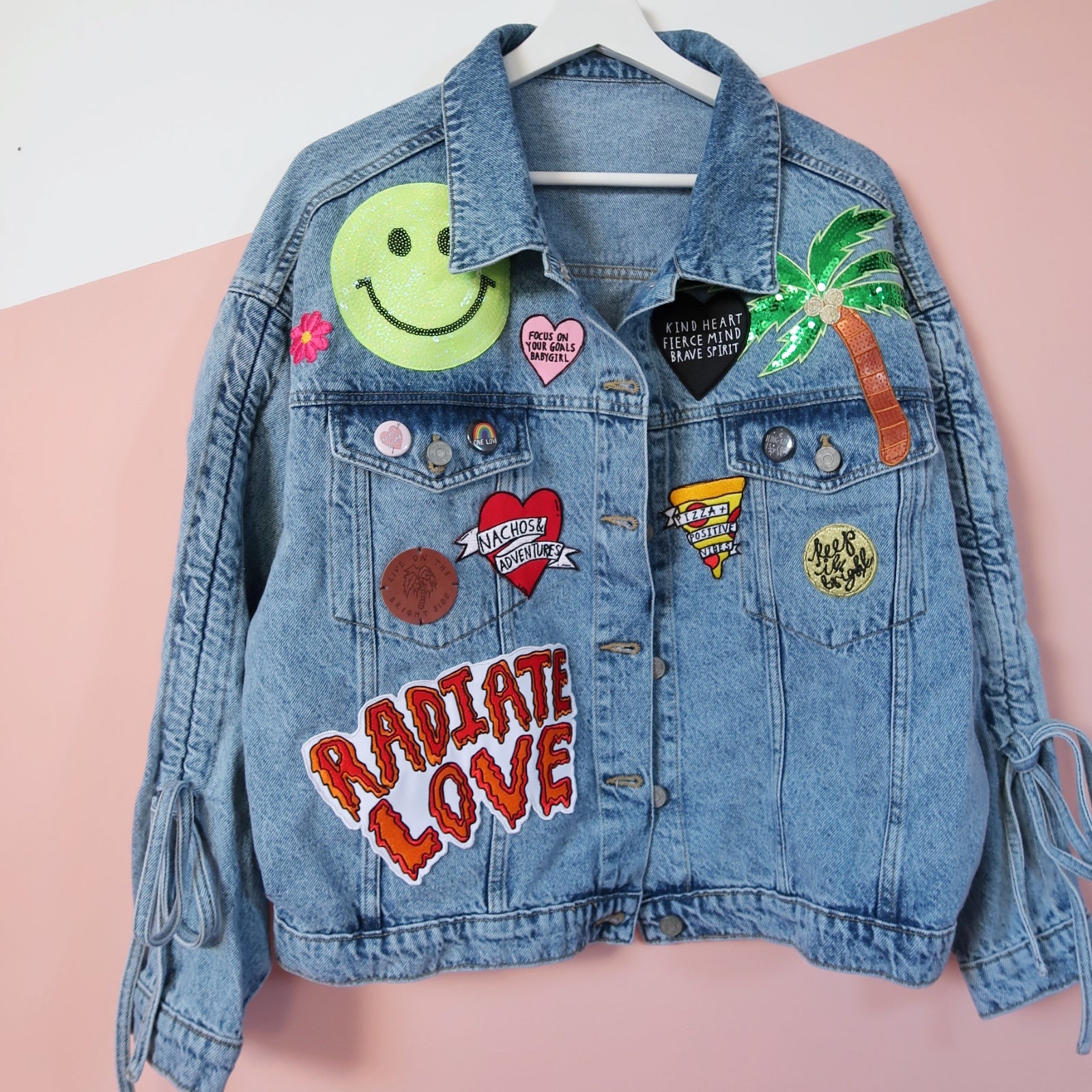 male fan wearing denim jacket customised with mulitiple sew on patches  badges stickers of bands knebworth heavy metal festival Stock Photo - Alamy