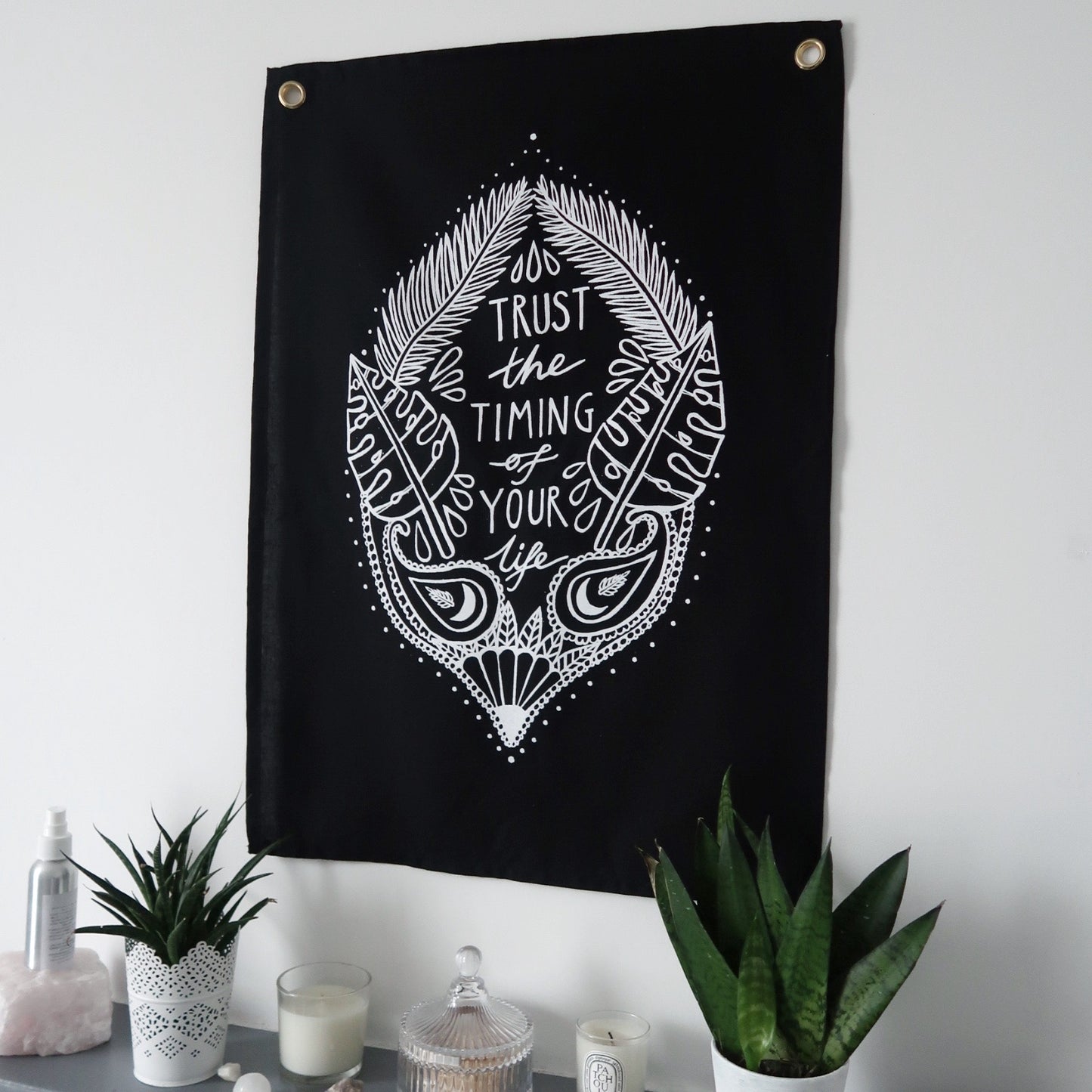 trust the timing of your life wall hanging - black