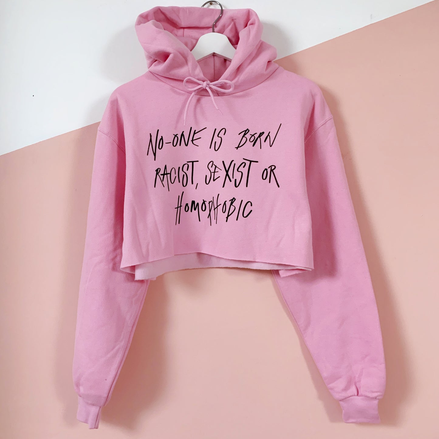 hate is taught cropped hoodie - baby pink